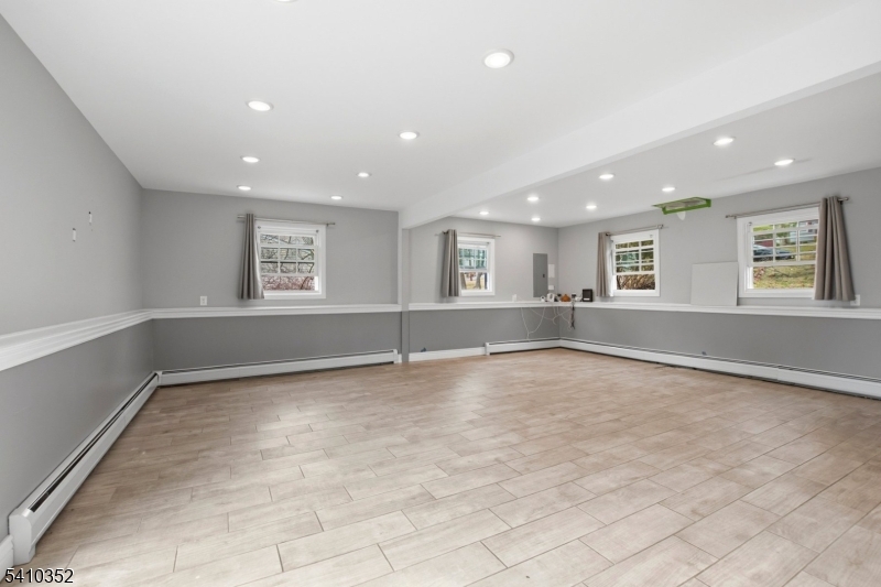 31 Blue Ridge Avenue Green Brook, NJ 08812 - Photo 21 of 28 an empty room with windows and pillars in it