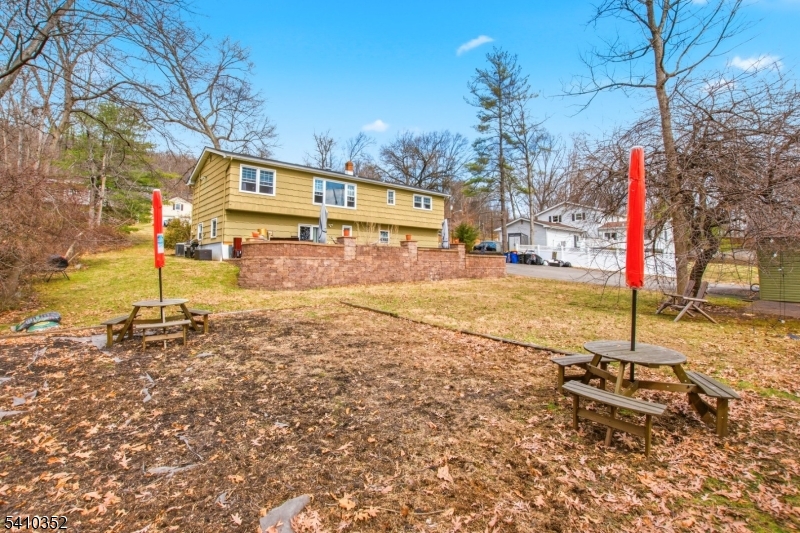 31 Blue Ridge Avenue Green Brook, NJ 08812 - Photo 23 of 28 a view of a yard with a tree on the road
