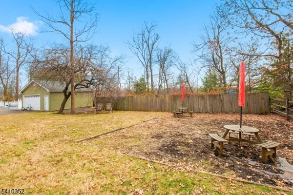 a backyard of a house with a trees