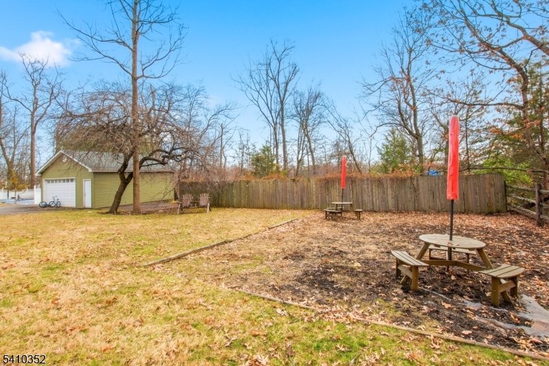 31 Blue Ridge Avenue Green Brook, NJ 08812 - Photo 24 of 28 a backyard of a house with a trees