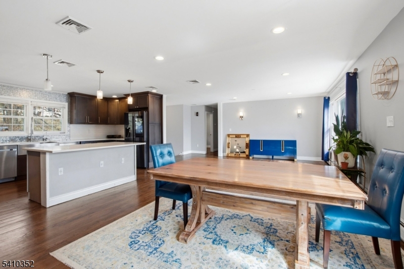 31 Blue Ridge Avenue Green Brook, NJ 08812 - Photo 5 of 28 a kitchen with a table chairs sink and refrigerator