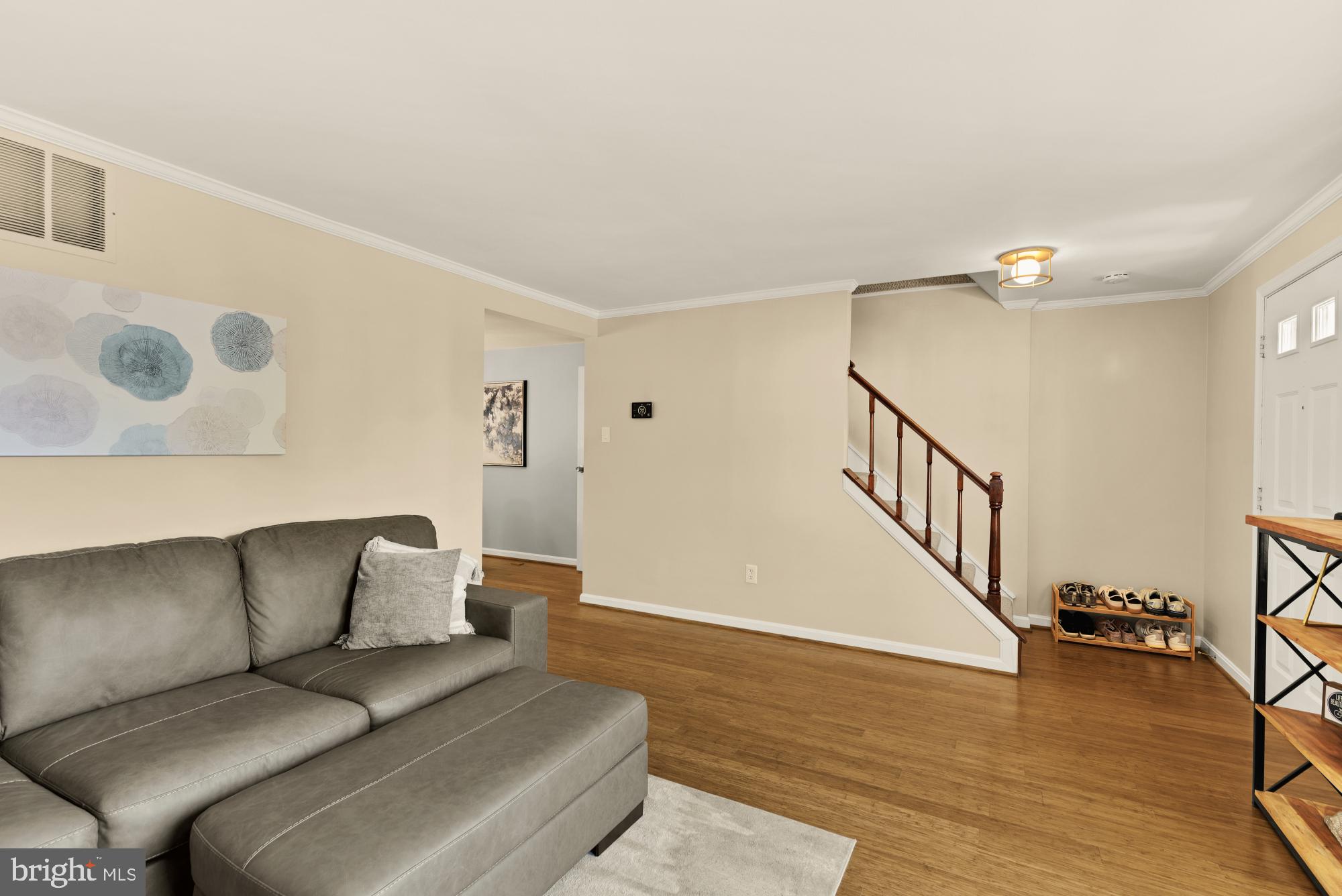 8100 Loving Forest Court Springfield, VA 22153 - Photo 7 of 33 a living room with furniture and a wooden floor