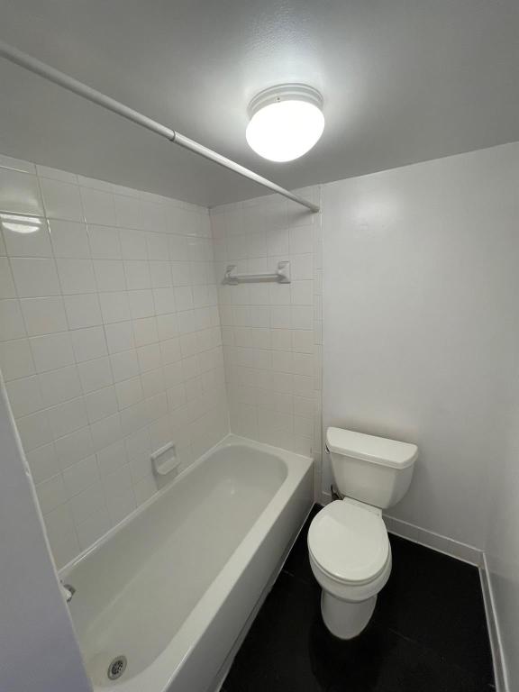 1212 Guadalupe Street, Unit 601 Austin, TX 78701 - Photo 5 of 5 Bathroom with shower / tub combination and tile patterned floors