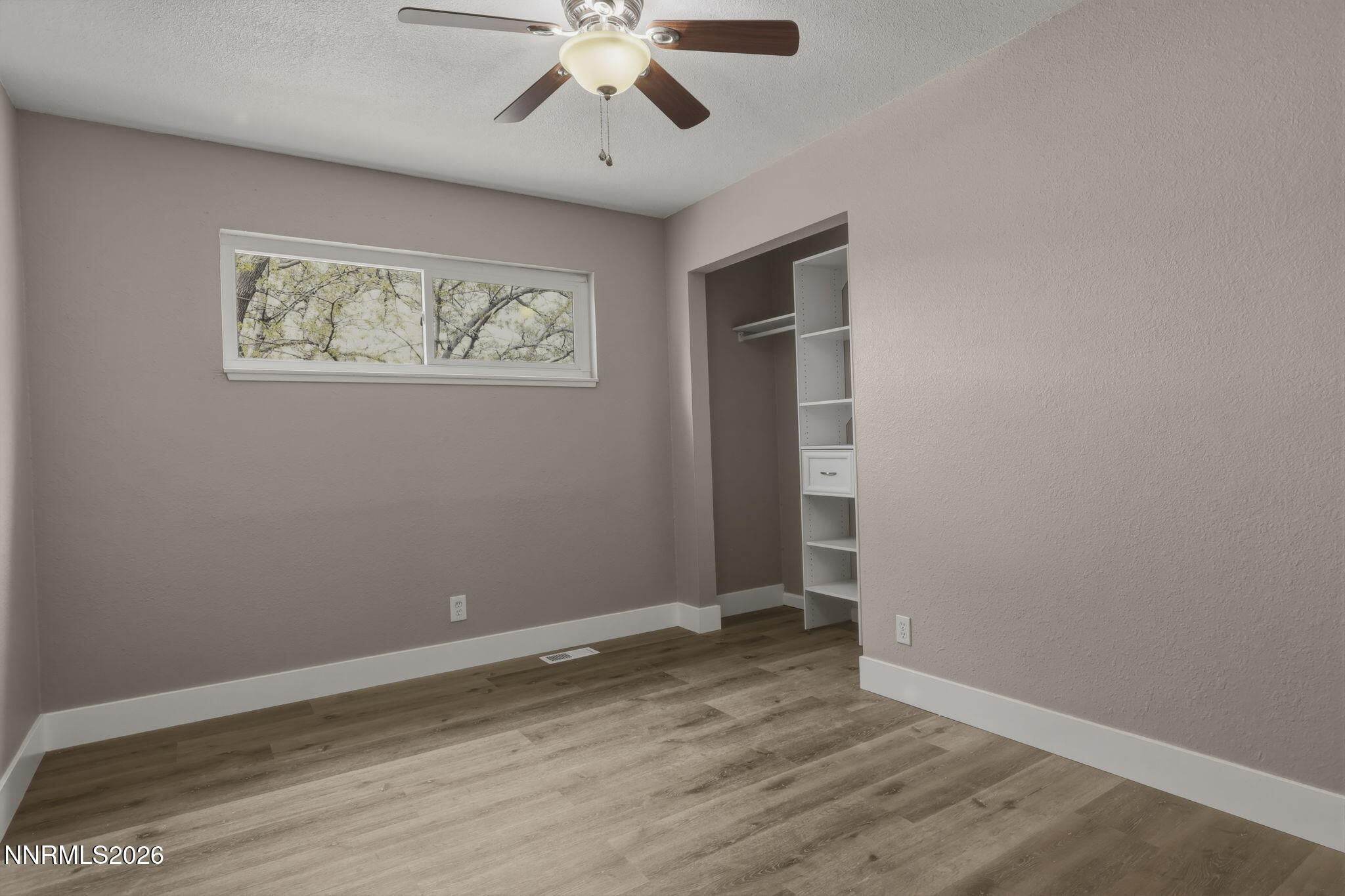 3260 Heights Drive Reno, NV 89503 - Photo 18 of 40 an empty room with wooden floor and ceiling fan