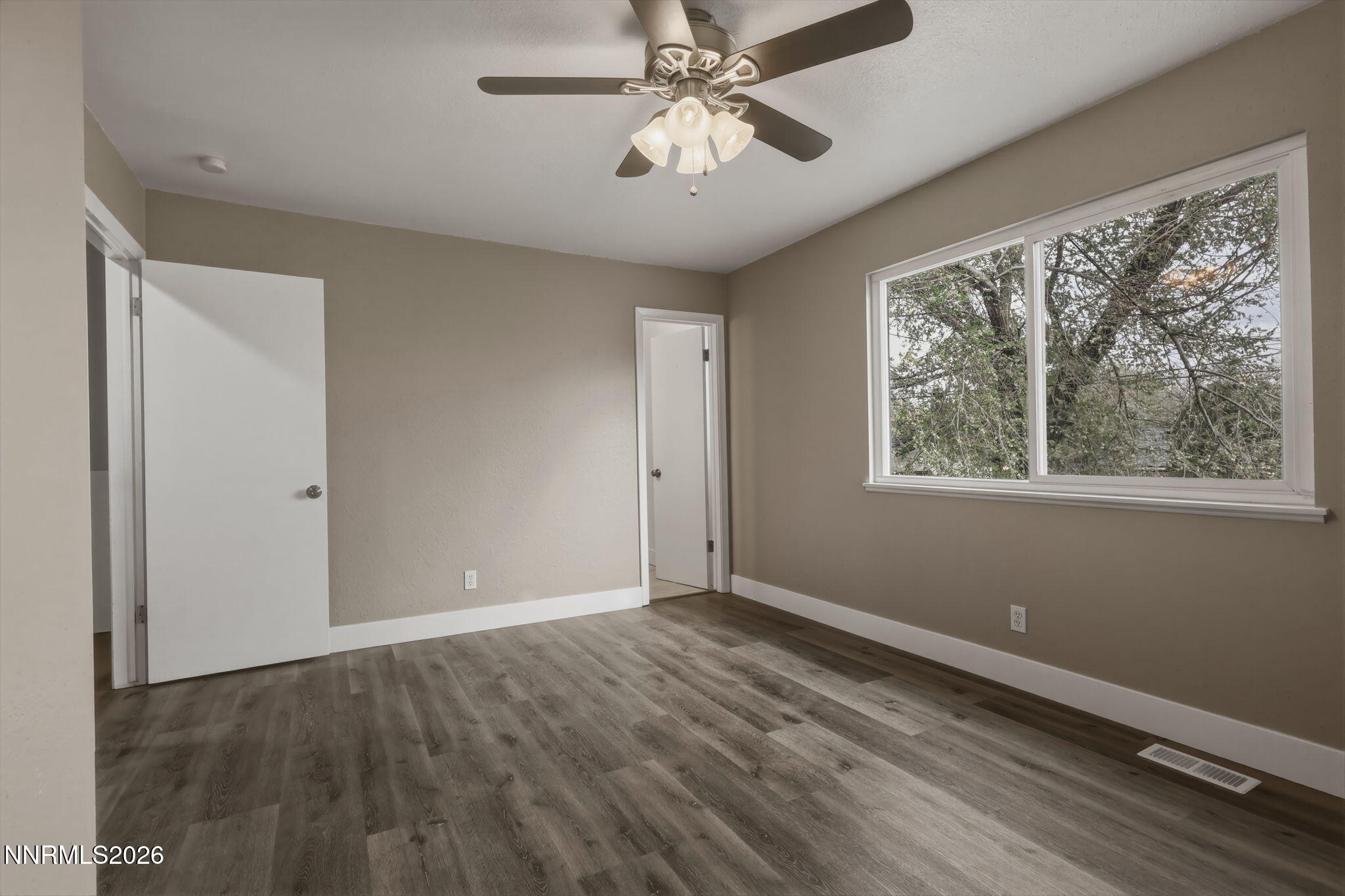 3260 Heights Drive Reno, NV 89503 - Photo 27 of 40 a view of an empty room with window and chandelier fan