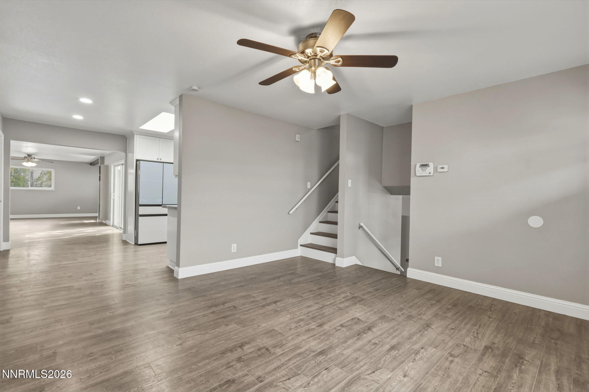 3260 Heights Drive Reno, NV 89503 - Photo 5 of 40 a view of an empty room with wooden floor and a ceiling fan