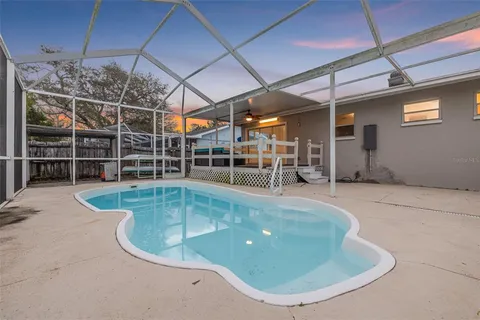 a view of a swimming pool with a patio