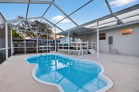 a view of a swimming pool with a patio