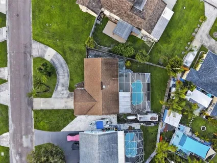 an aerial view of a house with outdoor space