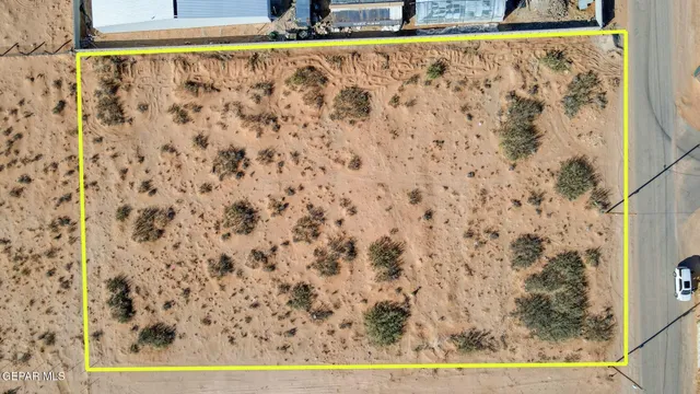 an aerial view of a house with a yard and garage