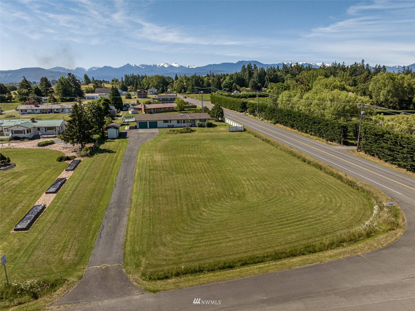 22 Libby Street Sequim, WA 98382 - Photo 4 of 40 a view of a swimming pool and lake view