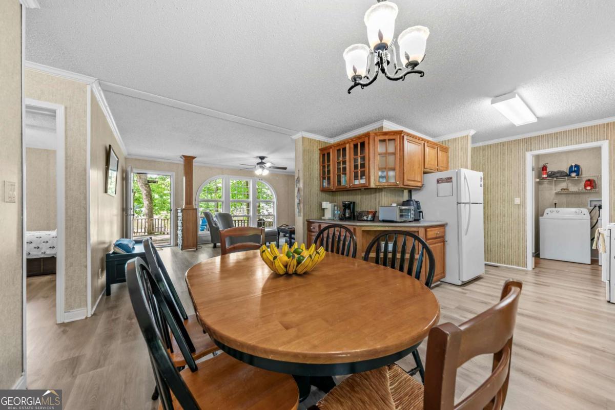 194 Phillips Road Eatonton, GA 31024 - Photo 14 of 57 a view of a dining room with furniture window and outside view