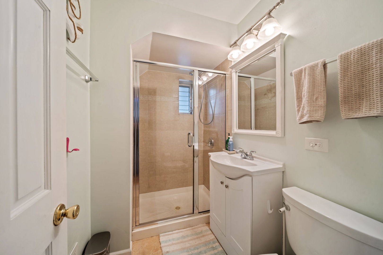 8243 Washington Street Niles, IL 60714 - Photo 22 of 30 a bathroom with a sink toilet and shower