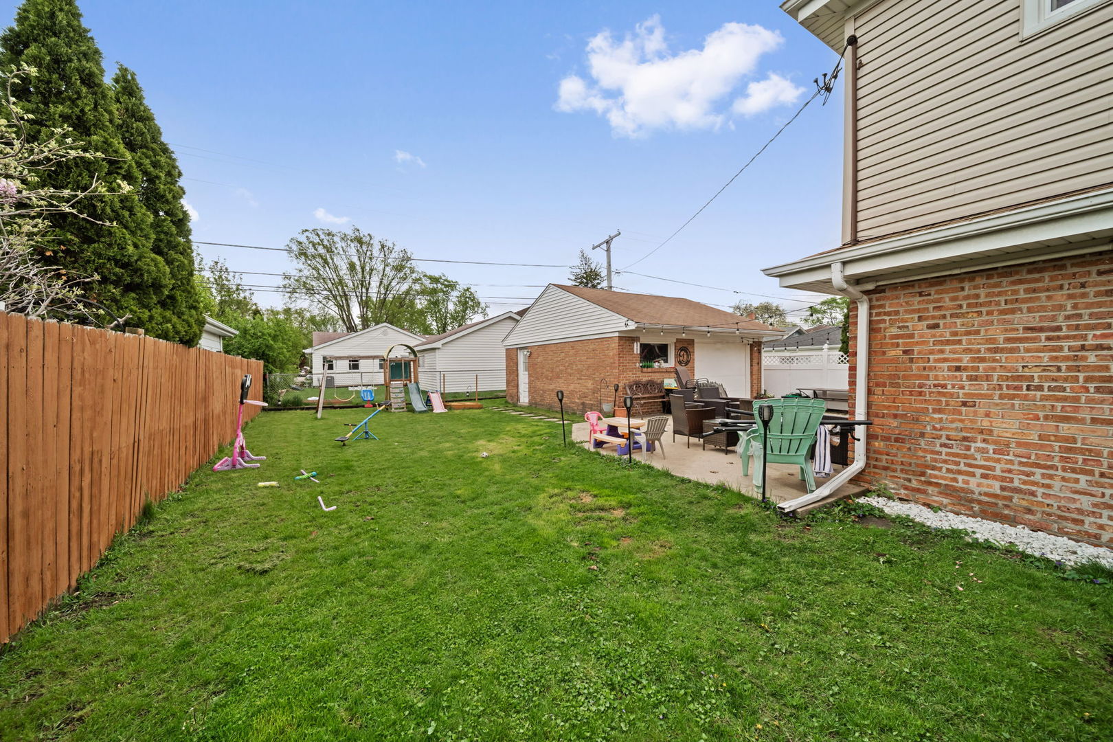 8243 Washington Street Niles, IL 60714 - Photo 24 of 30 a view of a house with backyard and sitting area