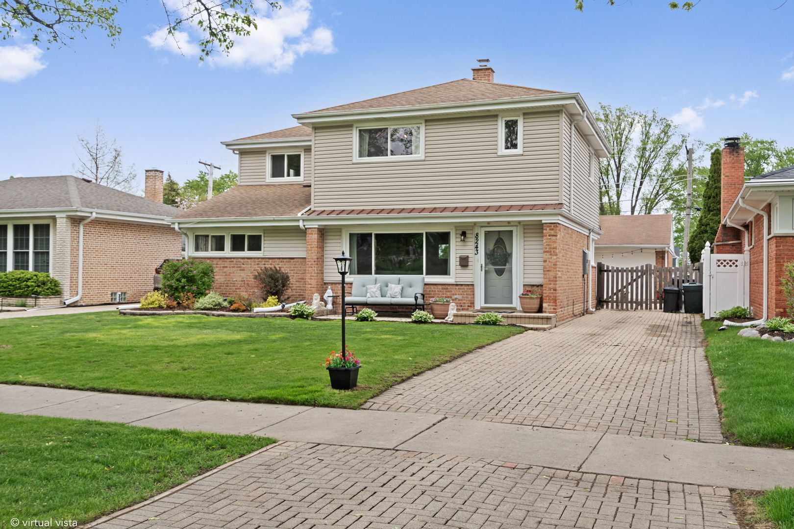 8243 Washington Street Niles, IL 60714 - Photo 25 of 30 a front view of a house with a garden