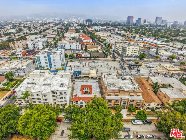 an aerial view of residential building and parking space