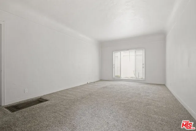 an empty room with window