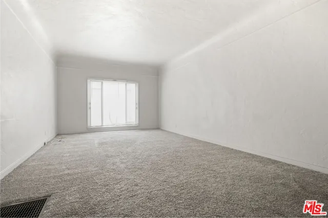 a view of an empty room and window