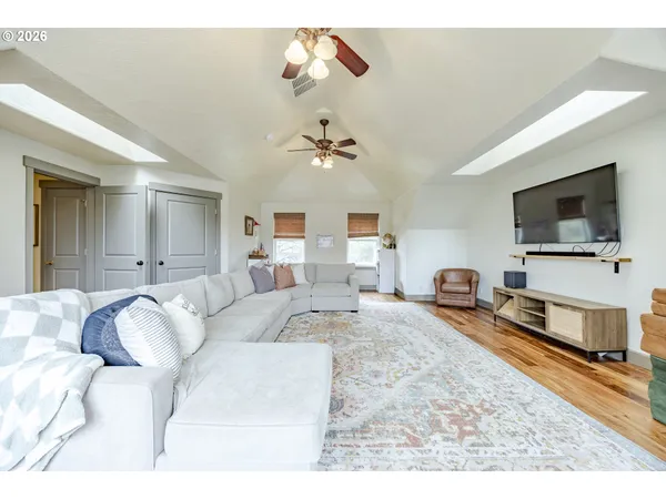 a living room with furniture fireplace and a flat screen tv