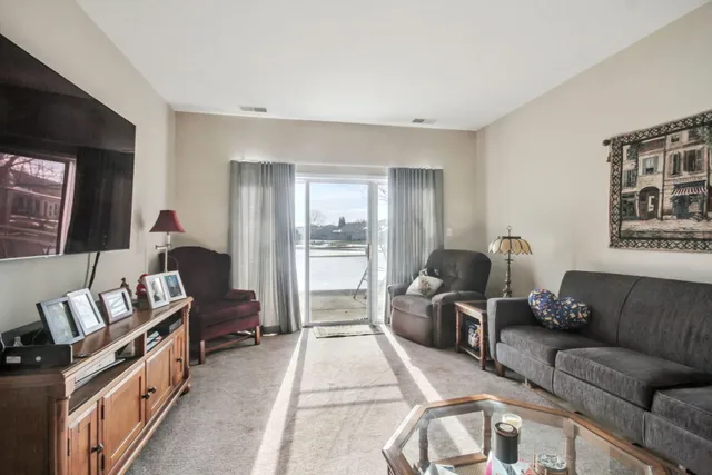 a living room with furniture fireplace and a flat screen tv