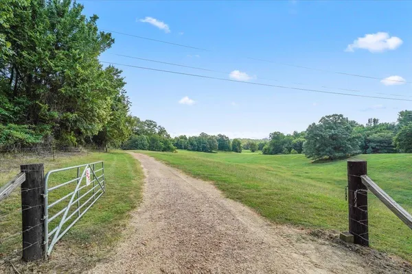 a view of a lake with a big yard