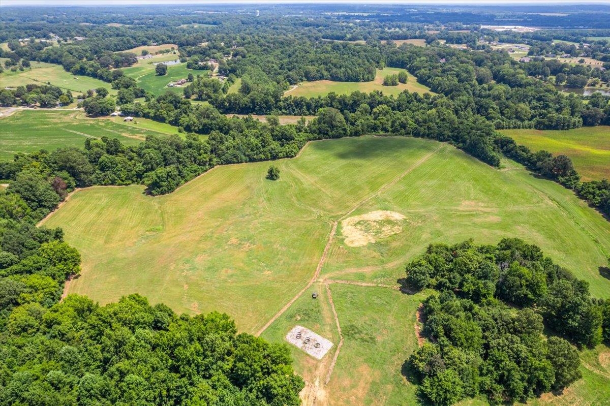 1040 Barlow Road Ripley, TN 38063 - Photo 21 of 35 an aerial view of residential houses with swimming pool