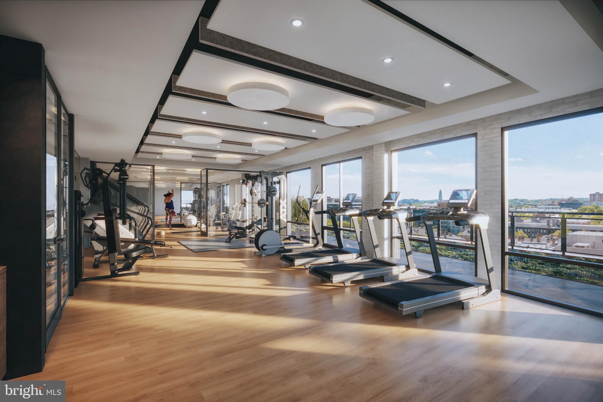 1111 North Fairfax Street, Unit 304 Alexandria, VA 22314 - Photo 11 of 12 a view of a hall with gym equipment