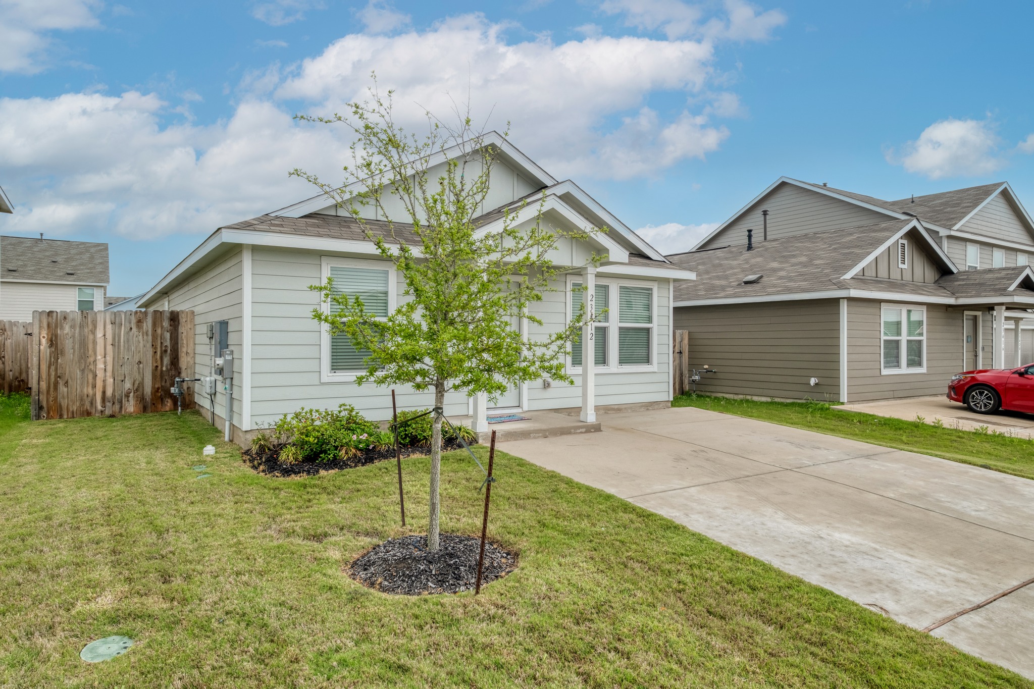 23412 Tiny Moons Way Elgin, TX 78621 - Photo 3 of 38 Single-story residence featuring light-colored siding and a covered front entry