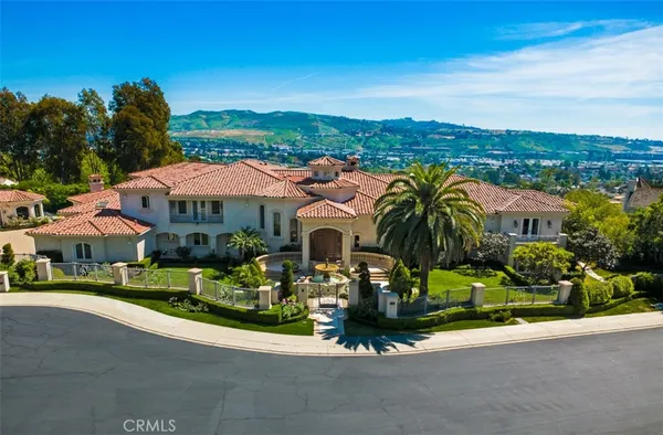 a living room with furniture fireplace and flat screen tv