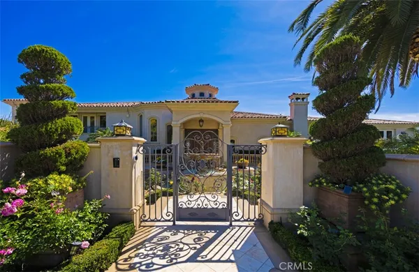 a living room with furniture a chandelier and a large window
