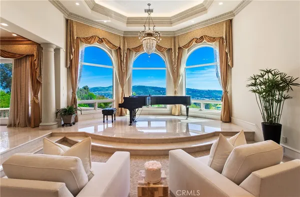 a bathroom with a tub and a large mirror