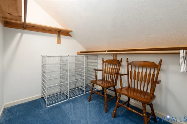 a view of a room with stairs and a chair