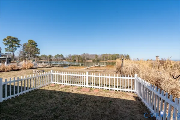 a view of a fence and trees