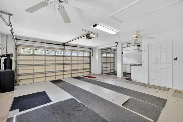 a spacious bedroom with a bed and a walk in closet