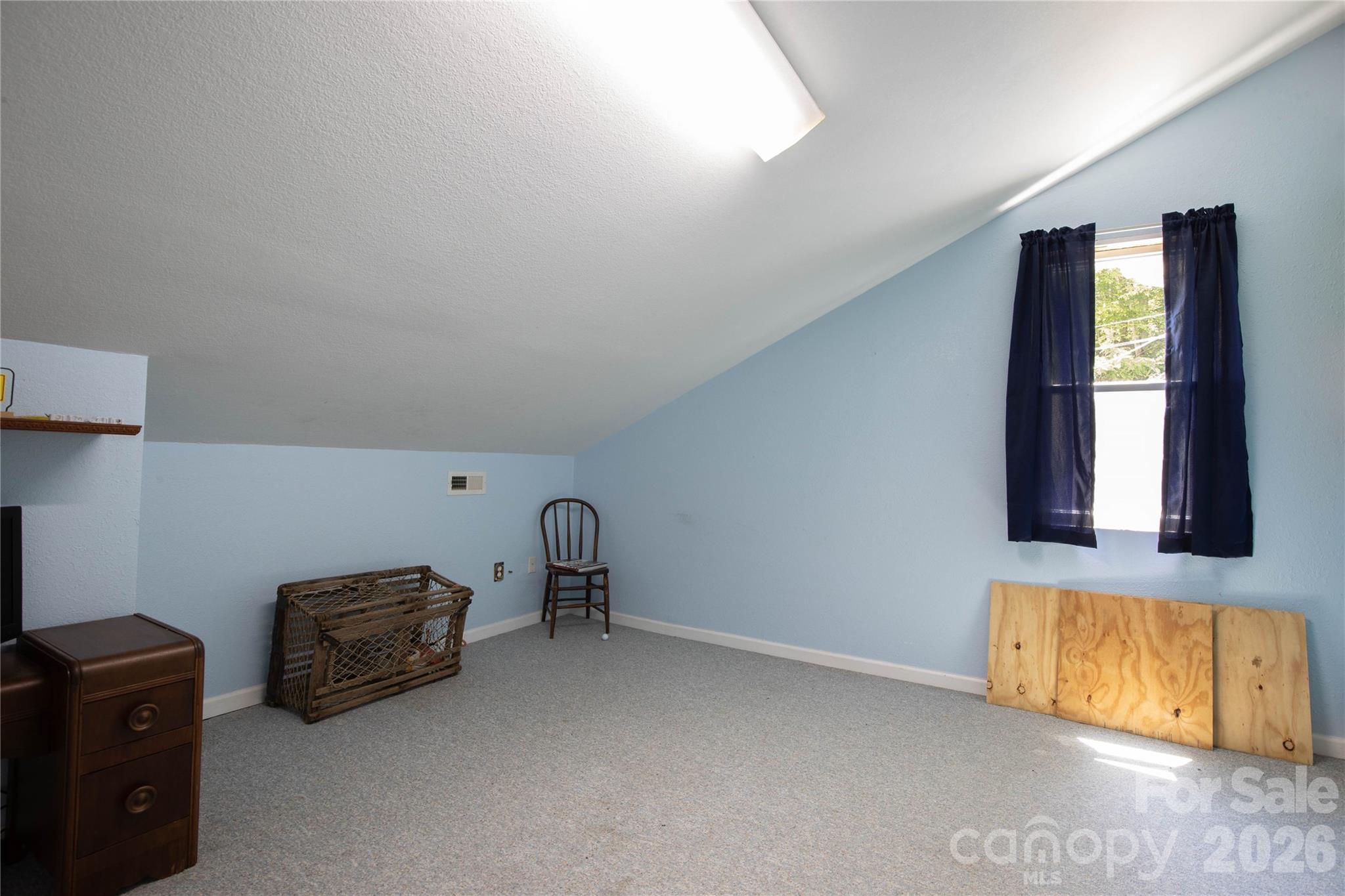 84 Sheets Farm Road Bakersville, NC 28705 - Photo 30 of 42 a living room with furniture and a window