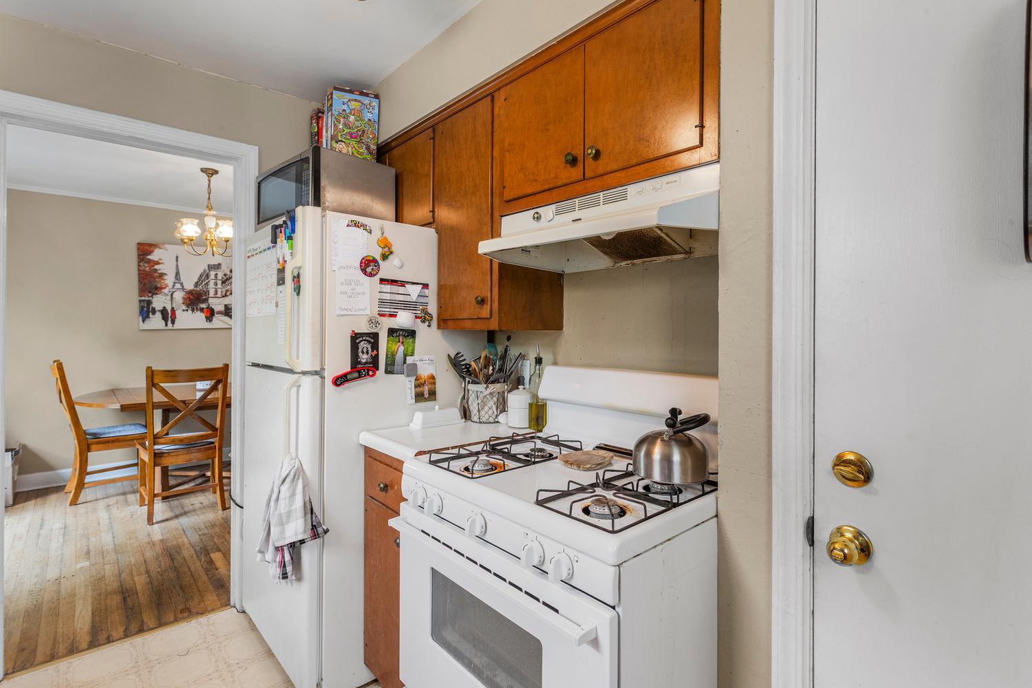1117 West Union Street Champaign, IL 61821 - Photo 18 of 29 a kitchen with a stove and refrigerator