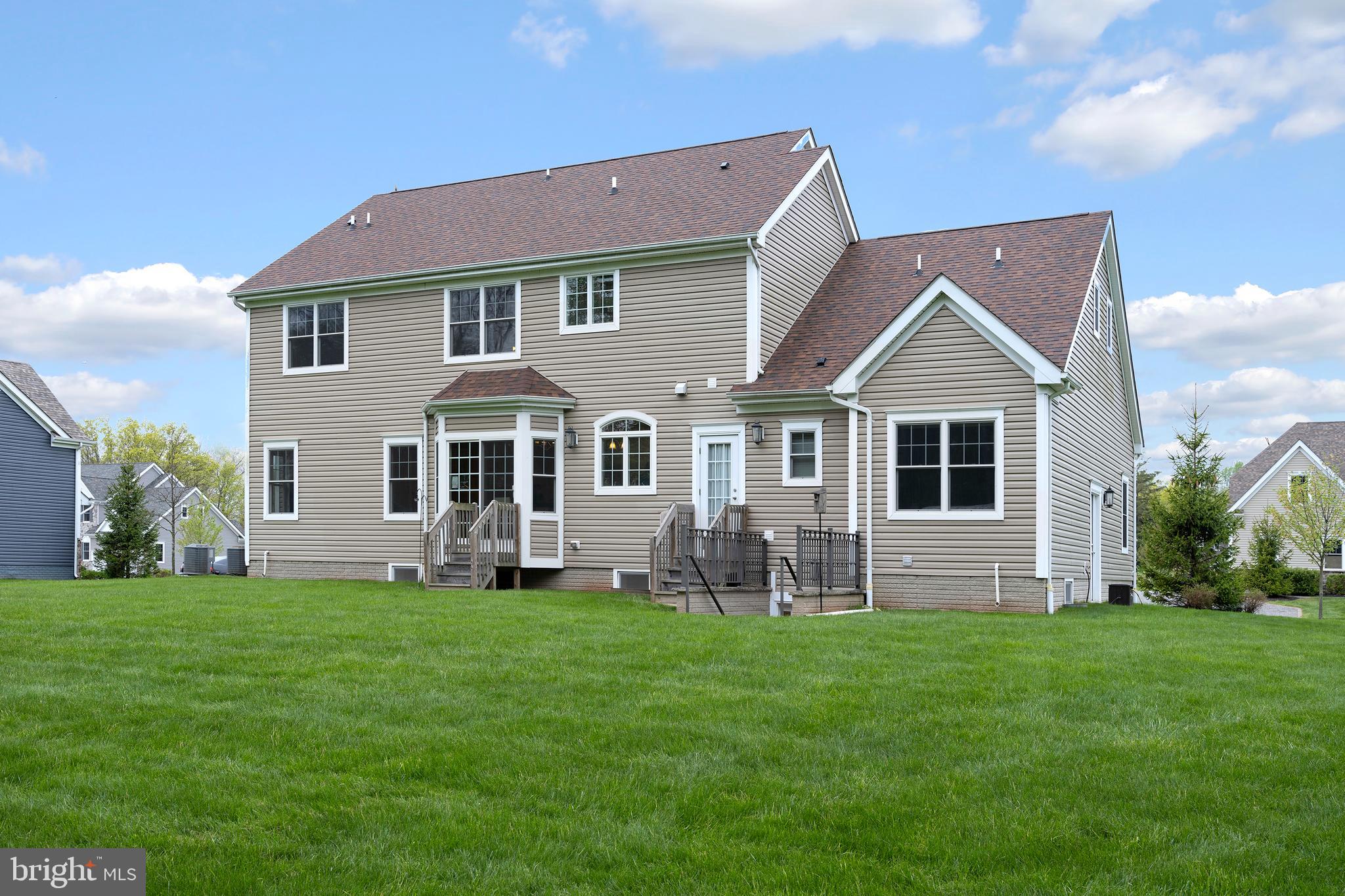 22 Liam Place Skillman, NJ 08558 - Photo 13 of 13 a front view of a house with a yard and garage