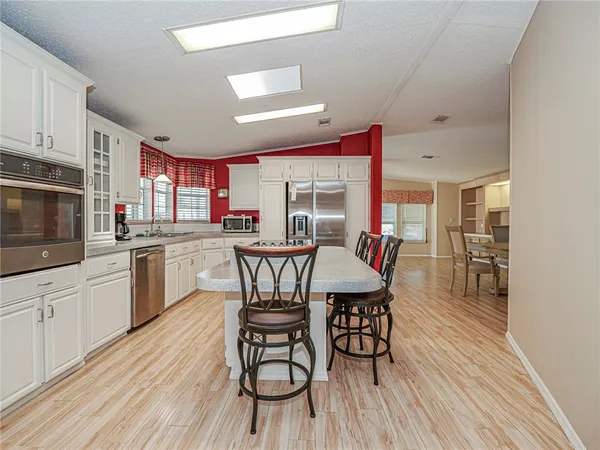 a bedroom with furniture and a chandelier