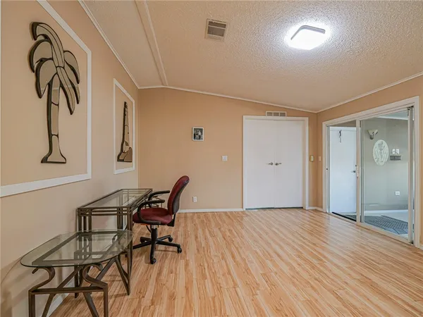 a bathroom with a granite countertop tub a sink and mirror