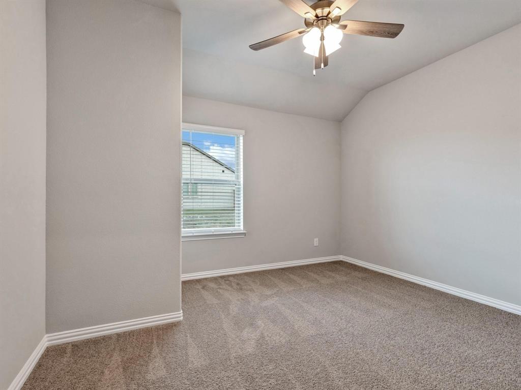 2106 Sandpiper Way Princeton, TX 75407 - Photo 24 of 39 an empty room with windows and fan