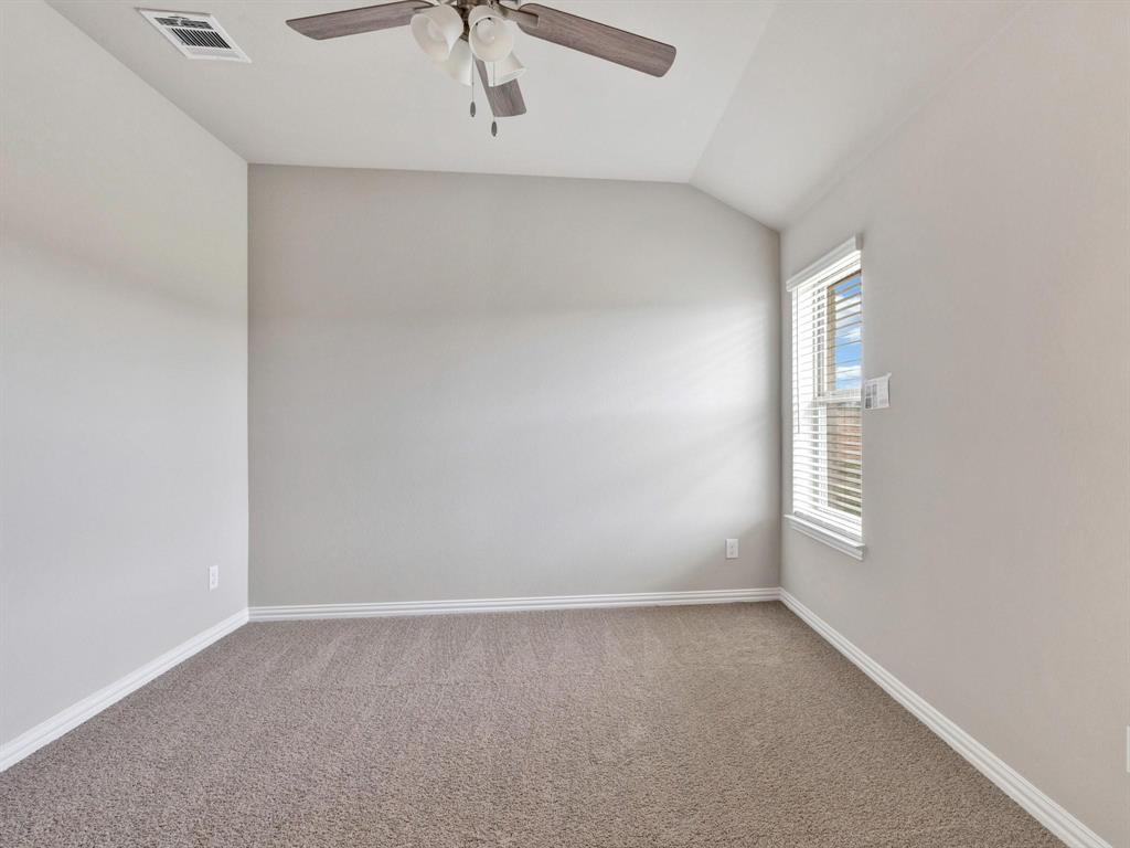2106 Sandpiper Way Princeton, TX 75407 - Photo 25 of 39 an empty room with windows