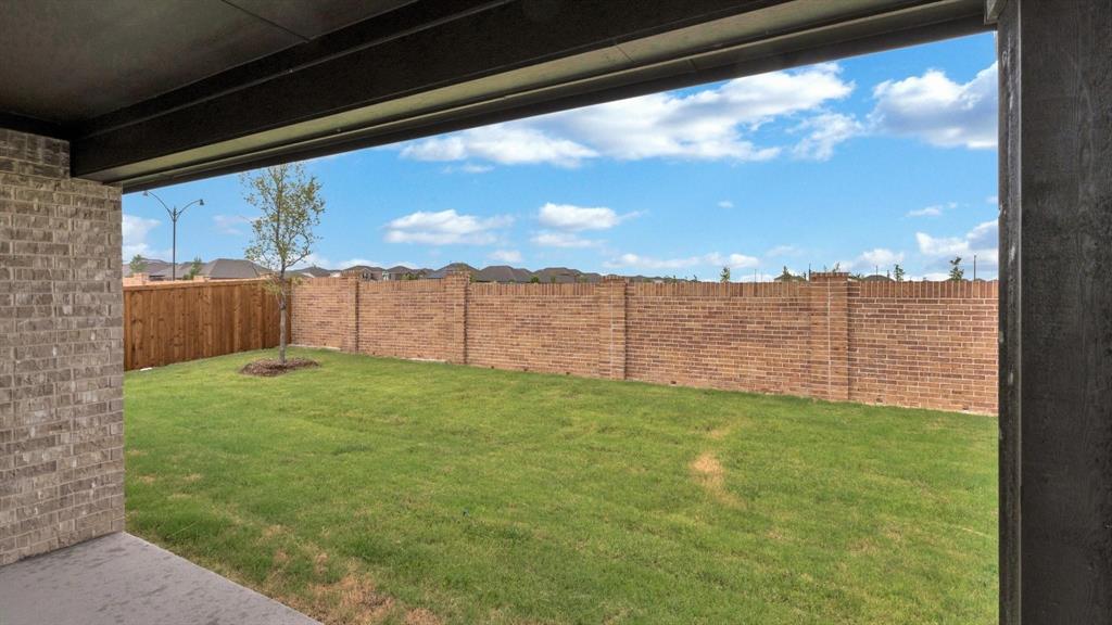 2106 Sandpiper Way Princeton, TX 75407 - Photo 35 of 39 a view of a backyard with a garden
