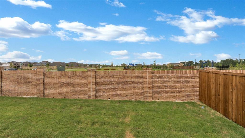 2106 Sandpiper Way Princeton, TX 75407 - Photo 36 of 39 a view of a lake from a yard