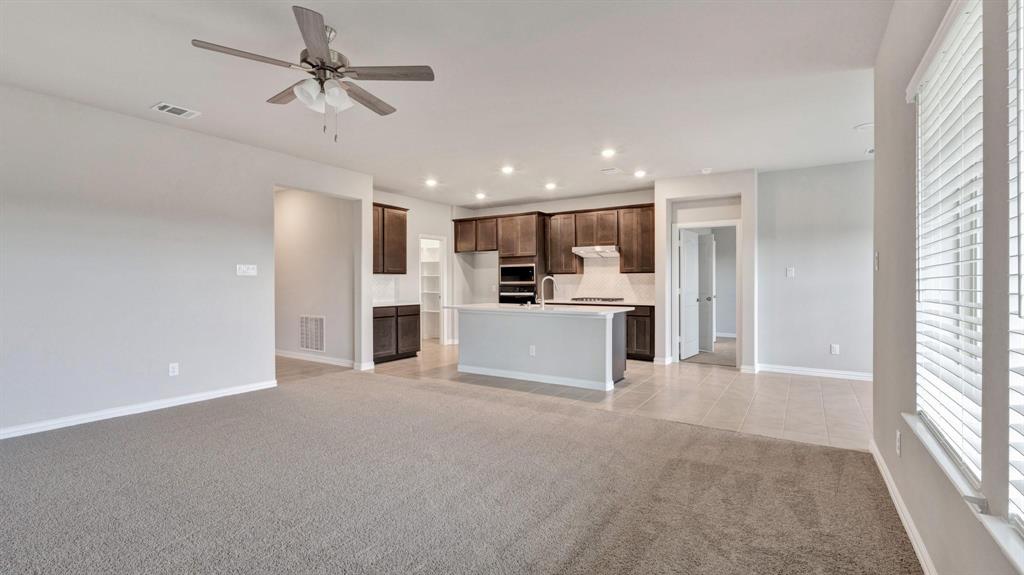 2106 Sandpiper Way Princeton, TX 75407 - Photo 5 of 39 a view of a kitchen with a sink and microwave