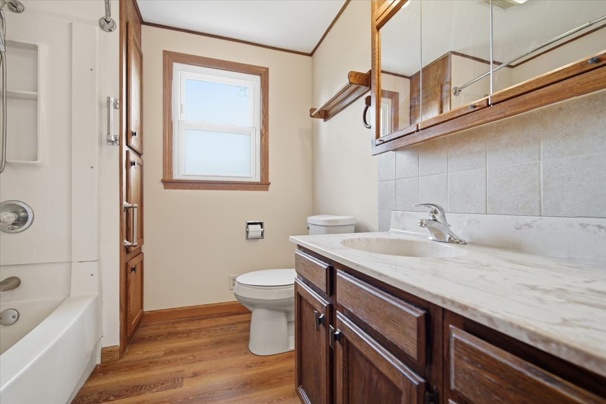 509 Smith Street Roanoke, IL 61561 - Photo 13 of 28 a bathroom with a sink a toilet and bathtub