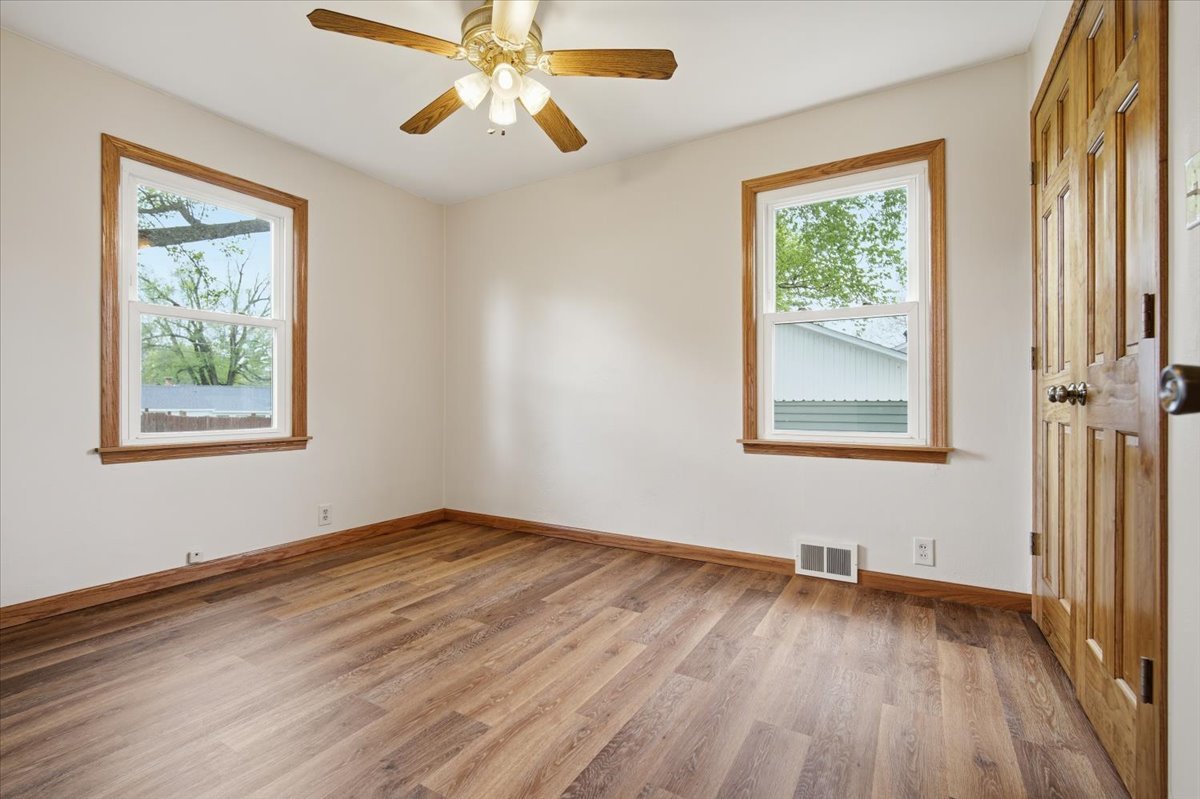 509 Smith Street Roanoke, IL 61561 - Photo 14 of 28 a view of empty room with wooden floor and fan