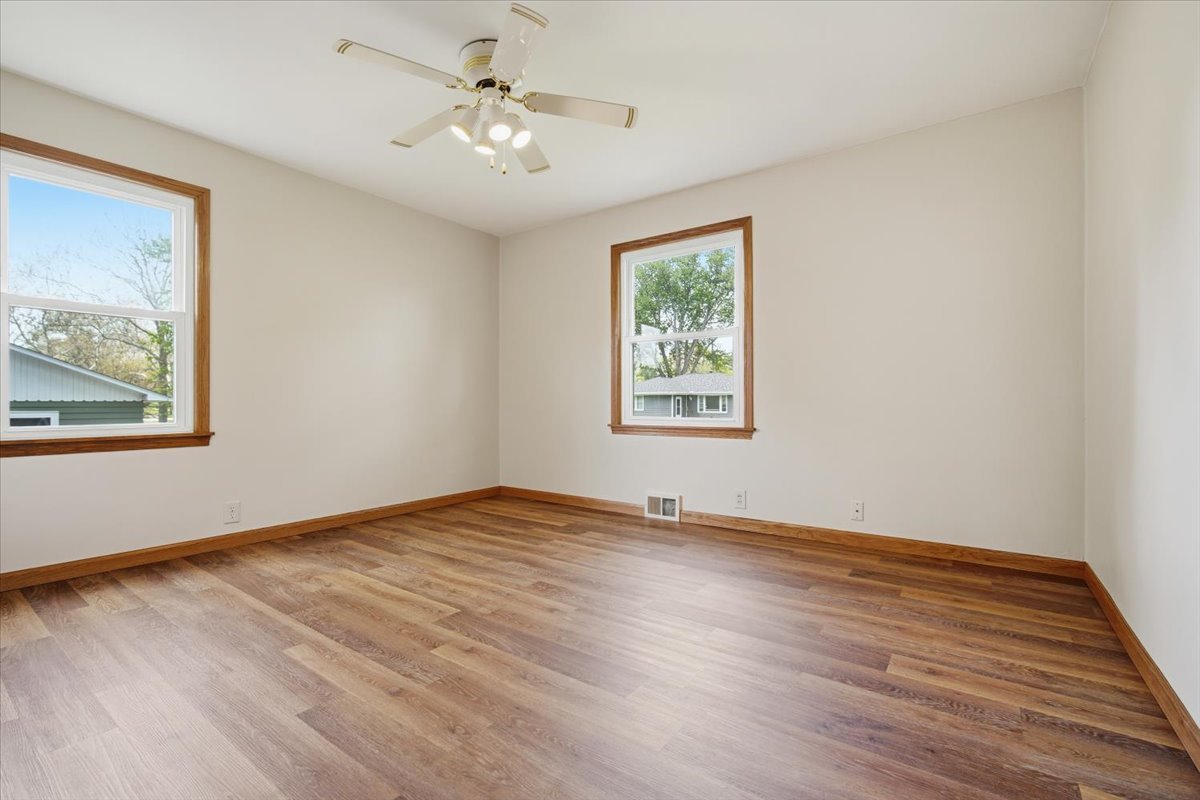 509 Smith Street Roanoke, IL 61561 - Photo 16 of 28 a view of empty room with wooden floor and fan