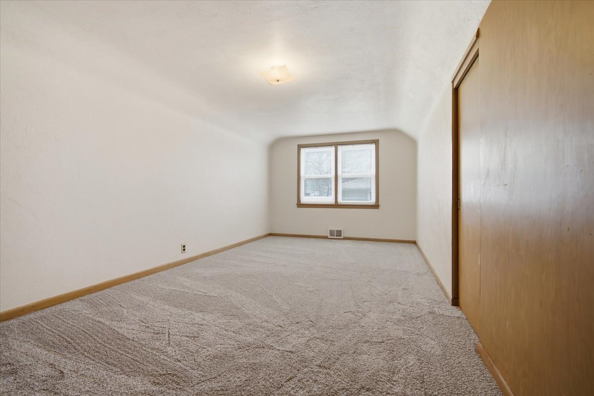 509 Smith Street Roanoke, IL 61561 - Photo 18 of 28 an empty room with windows and closet