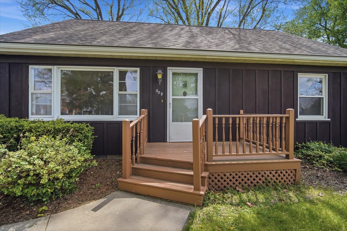 509 Smith Street Roanoke, IL 61561 - Photo 3 of 28 a view of house with a small yard and wooden fence