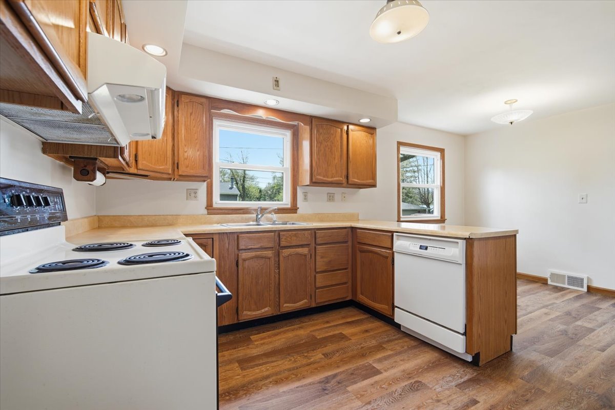 509 Smith Street Roanoke, IL 61561 - Photo 4 of 28 a kitchen with appliances a sink and a window